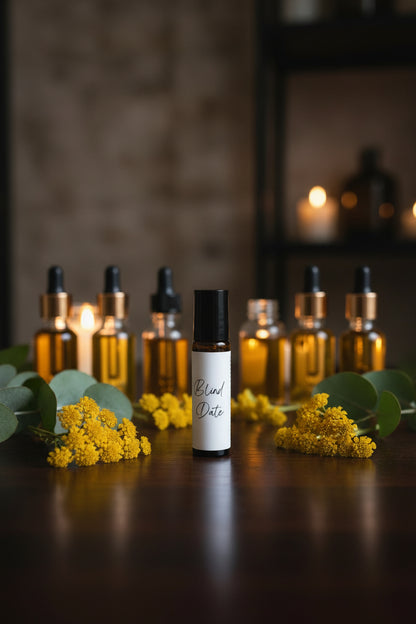 Everlasting Skin Oil by A Blind Date featuring helichrysum essential oil, jojoba oil, rosehip oil, and avocado oil in a handcrafted roller bottle surrounded by natural botanical ingredients.