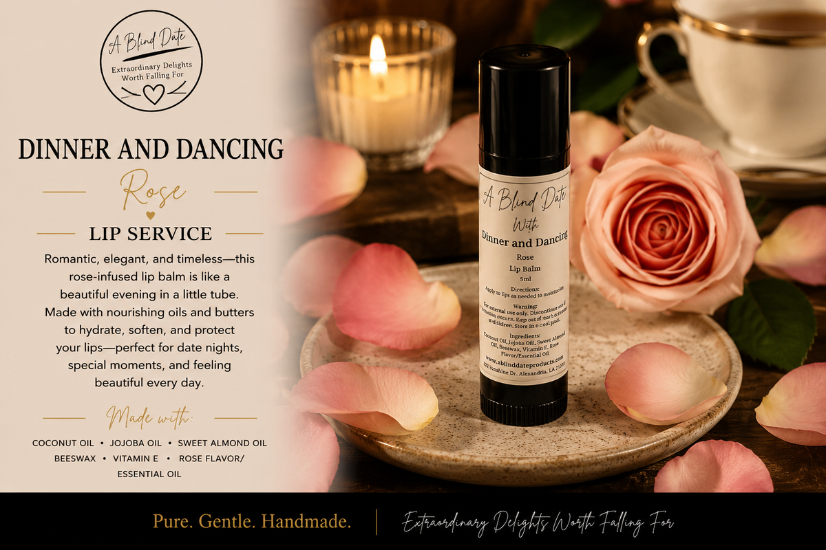 A black roll-on lip balm bottle labeled 'A Blood Cave Rose' is displayed on a stone surface with pink roses and petals, alongside a candle and teacup in a softly lit setting. The left side includes descriptive text about the 'Dinner and Dancing' rose-infused lip balm.