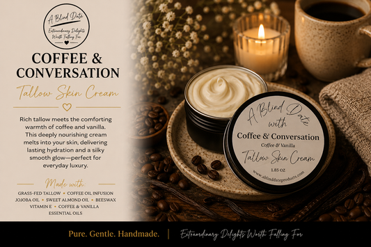 A jar of Tallow Skin Cream by A Blind Date with Coffee & Conversation is shown open on a rustic wooden surface, with a branded lid beside it, a lit candle, a mug, dried flowers, and a folded towel in the background. Product text and branding are printed on the lid and left side of the image.
