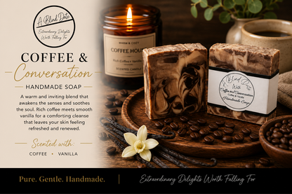 Handmade coffee and vanilla scented soap bars displayed on a wooden tray with coffee beans, a lit candle, and a vanilla flower. The soaps have a swirled brown and cream pattern, with one bar in a white paper band labeled 'A Blend of Delicious Handmade Soap'.