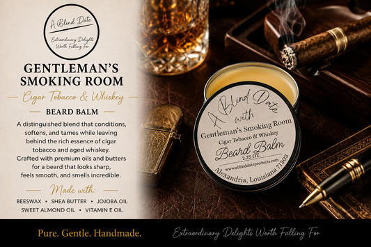 Luxury promotional image for A Blind Date's Gentleman's Smoking Room Beard Balm. An open tin of smooth beard balm and the labeled lid are displayed on a rich leather surface beside a crystal glass of whiskey, a lit cigar in an ashtray, a vintage lighter, and a fountain pen. The left side highlights the product name, "Gentleman's Smoking Room," with "Cigar Tobacco & Whiskey" in gold script, along with a description of its conditioning benefits and ingredients including beeswax, shea butter, jojoba oil, sweet